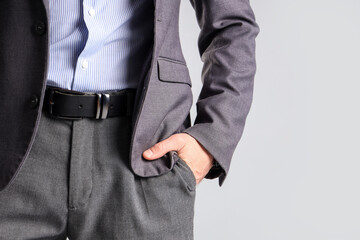 Businessman in suit on light background, closeup