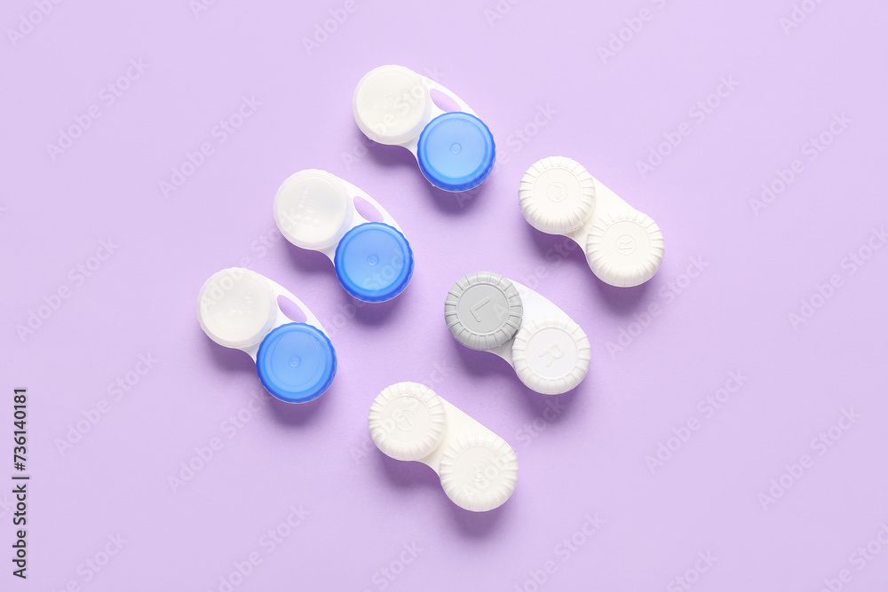 Wall mural Containers for contact lenses on lilac background