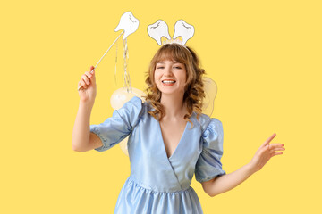 Tooth Fairy with wand on yellow background