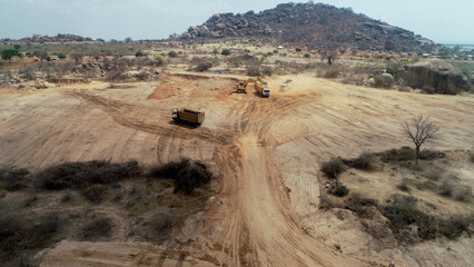 construction machines at works, dozer, roller machine, excavator, crawler rock drill machine, trucks, GPS grader