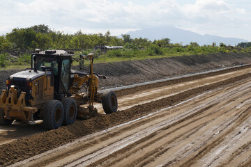 construction machines at works, dozer, roller machine, excavator, crawler rock drill machine, trucks, GPS grader