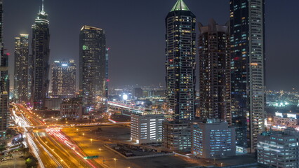 Business bay district skyline with modern architecture day to night timelapse from above.