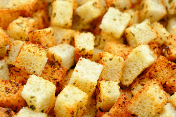 fried crackers. small cubes of crackers with spices, close-up, crackers concept