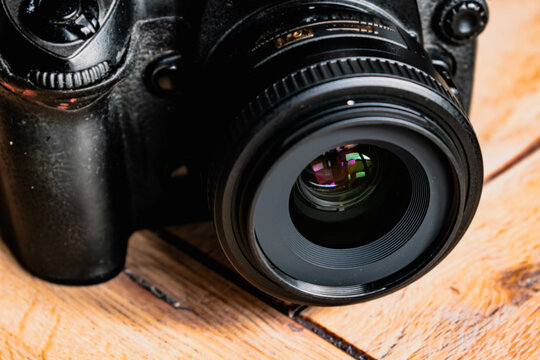 Reflex camera or dslr with reflexion on lens, photograph equipment, for professionnal and agency