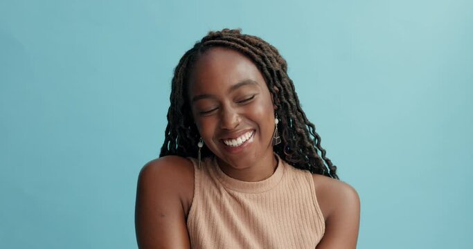 Face, black woman and happy with fashion in braids, studio and blue background with smile and satisfied. Style, trends and positive mood with energy, excitement and joy with clothes and accessory.