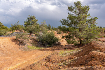 Site view of Sia Mine Red Lake, a former copper and pyrite mine excavation basin filled with water,...