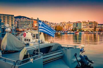 Splendid spring seascape on Aegean Sea with motorboard. Nice evening view of Kavala city, the...