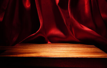 empty wooden floor Elegant wavy red cloth backdrop (Focus on a specific point)