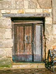 Wooden aged antique door of an European rural village. - 736223710