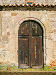 Wooden aged antique door of an European rural village. - 736223764