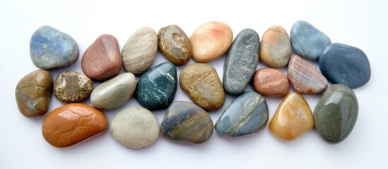 Fototapeta na wymiar Vibrant and colorful assorted rocks collection on a clean white surface