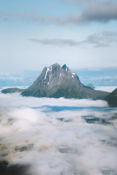 Norway landscape aerial view mountain peak above clouds Sunnmore Alps travel beautiful places destinations summer season scandinavian nature morning scenery