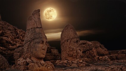 Antique ruined statues on Nemrut mountain in Turkey. ancient Kingdom of Commagene in south east...