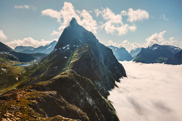 Mountain peak above clouds landscape in Norway aerial view travel destinations Sunnmore Alps scenery scandinavian wild nature - 736236930