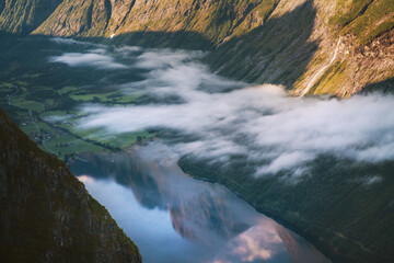 Aerial fjord view in Norway mountain reflection in water landscape morning clouds, Sunnmore Alps scandinavian nature beautiful destinations travel scenery - 736240572
