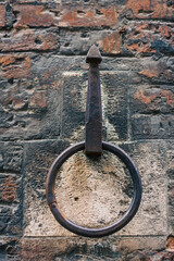 Fototapeta premium Iron ring on the building's wall in Siena, Italy