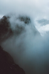 Foggy misty mountains landscape in Norway scandinavian nature moody minimalistic scenery travel destination dramatic view