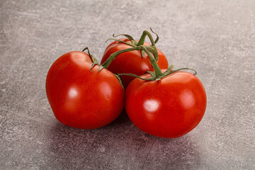 Sweet ripe tomatoes on the branch