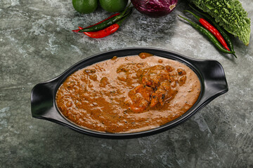 Indian cuisine - chicken curry with spices