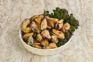 Tasty marinated mussels in the bowl