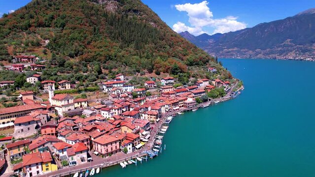 Amazing lake Iseo scenery with picturesque town Lovere, aerial drone view. Italy, Brescia province