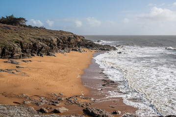 Beautiful seaside landscape from a drone, rocky sandy coast on the Atlantic Ocean in France.