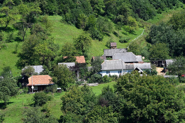 Fototapeta na wymiar Village with a church in a mountain valley, Transcarpathia, Ukraine.