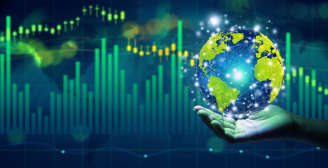 Businessman holding globe over the stock market financial data. Copy space. World Financial Concept.