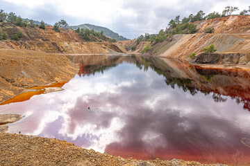 Colorful view of Sia Mine Red Lake, a former copper and pyrite mine excavation basin filled with...