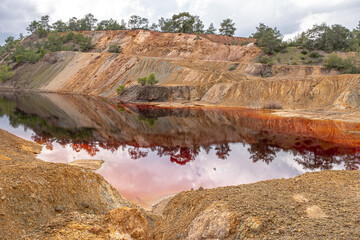 Colorful view of Sia Mine Red Lake, a former copper and pyrite mine excavation basin filled with...