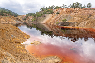 Colorful view of Sia Mine Red Lake, a former copper and pyrite mine excavation basin filled with...