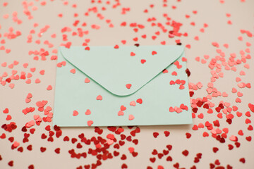 Blue envelope and red heart confetti