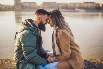 Happy couple holding hands while enjoy spending time together outdoor.
