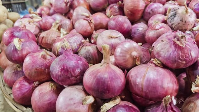Closeup of a organic onion displayed for sale at a local vegetable market
