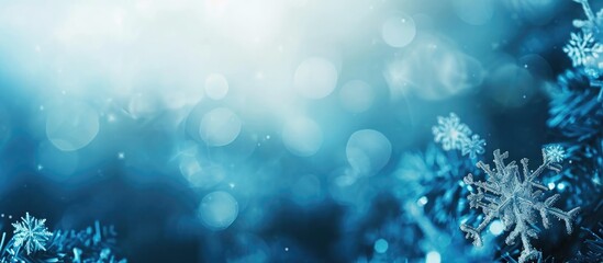 Blurred blue background with abstract snowflakes.