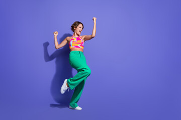 Fototapeta na wymiar Full length photo of crazy cheerful glad woman win lottery jackpot scream yes hooray empty space isolated on purple color background