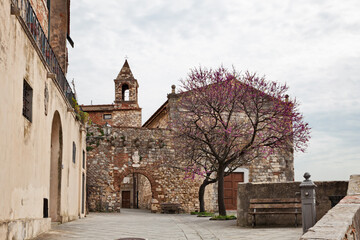 Rosignano Marittimo, Livorno, Tuscany, Italy. The ancient church Oratory of St. John the Baptist and St. Hilary and the gateway to the courtyard of the medieval castle - 736362738