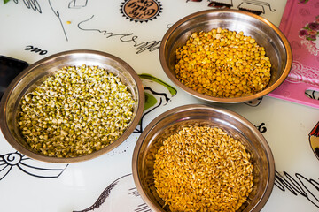 sprouted wheat and peas on a plate on the table.