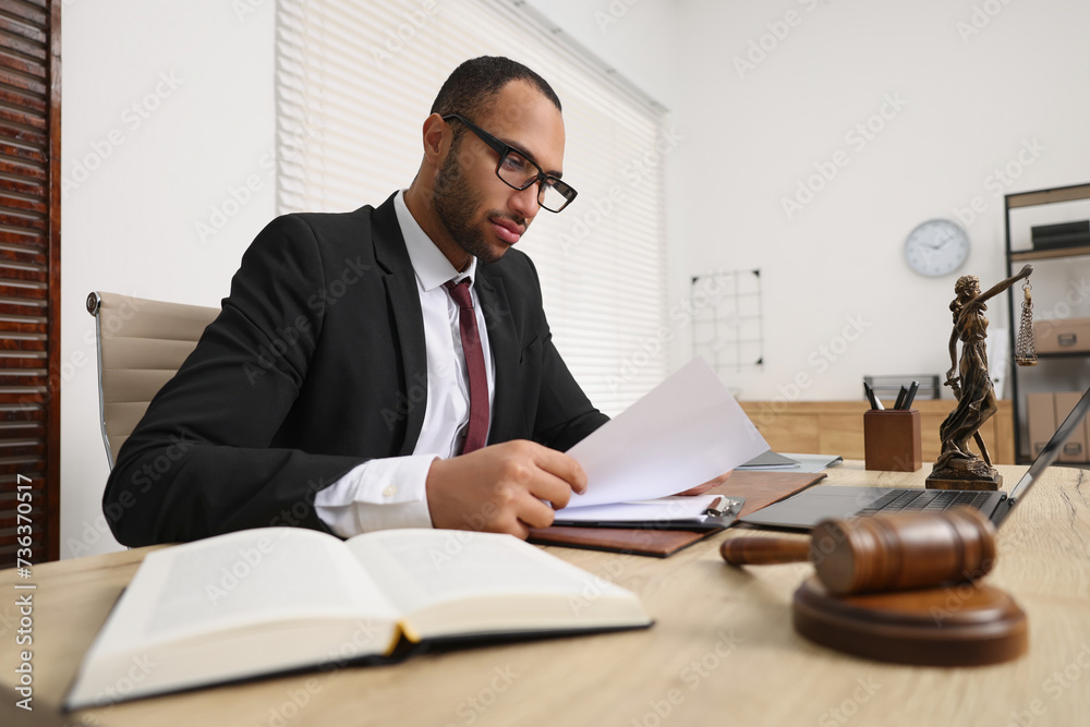 Sticker Confident lawyer working with document at table in office