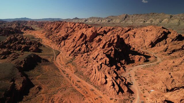 Aerial above red sandstone fins in unique Moapa Valley Nevada desert near Valley of Fire State park