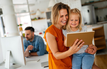 Device technology family online education concept. Happy family with digital devices at home.