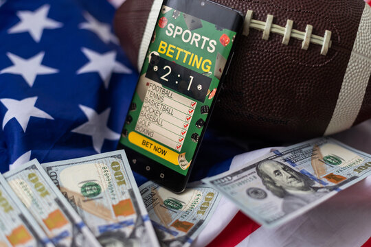 rugby ball and dollars with usa flag and smartphone bet