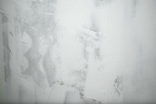 Imagen horizontal de una pared con textura color blanco y gris ideal para fondos 
