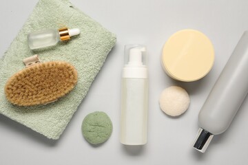 Bath accessories. Flat lay composition with personal care products on light grey background