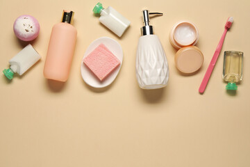 Bath accessories. Flat lay composition with personal care products on beige background, space for...