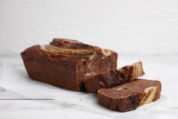 Delicious banana bread on white wooden table