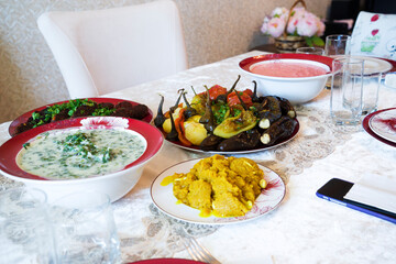 A variety of vegetarian dishes on the plates on the table