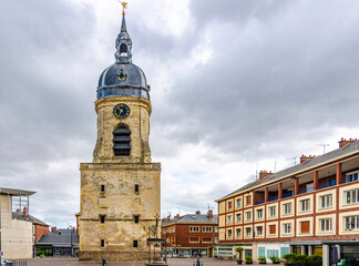 Belfry of Amiens beffroi d'Amiens bell tower stone building with clock and spire and stone well on empty square in old historical city centre, Somme department, Hauts-de-France Region, France