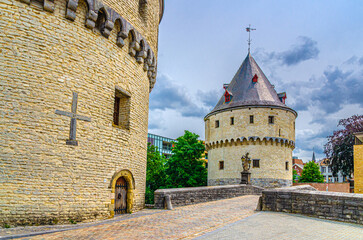 Broeltorens Broel Towers Gothic architecture style stone medieval buildings, John of Nepomuk statue on Broel Bridge in Kortrijk city, Fortification towers, belgium landmark, Flemish Region, Belgium