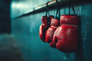 Foto auf Acrylglas Antireflex A lineup of vibrant red boxing gloves suspended on a wall, showcasing the equipment used in combat sports, Boxing gloves hanging on a gym wall, AI Generated © Iftikhar alam